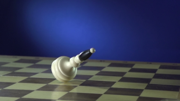 Chess Pieces Falling Down On Blue.