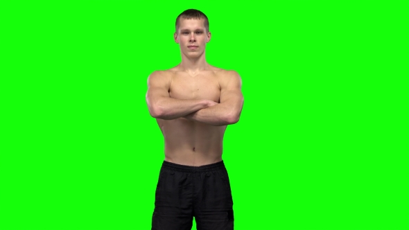 Man Shows Different Muscle Groups. Green Screen