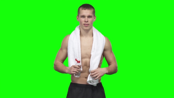 Sportsman Is Drinking Water And Towels. Green Screen