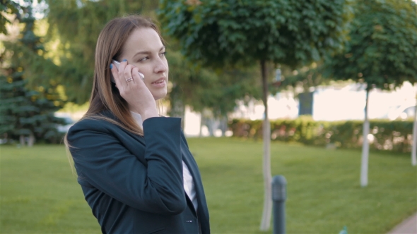 Portrait Of Business Woman Making a Phone Call Outdoors