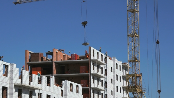 Construction Crane Delivers a Cement For Builders