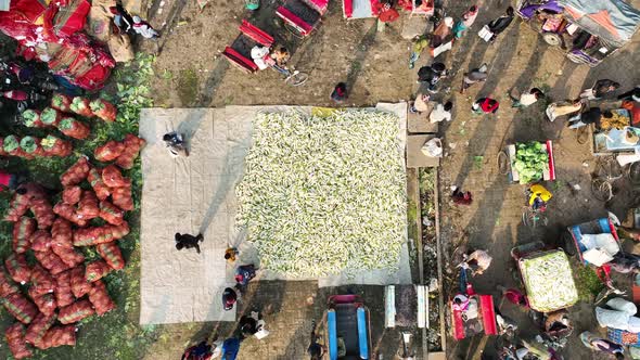 Aerial view of people in a food market in Shibganj, Rajshahi state, Bangladesh.