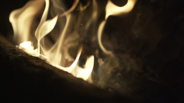 Burning Wood In The Fireplace