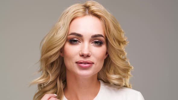 Caucasian Woman Posing for Photographer in Studio