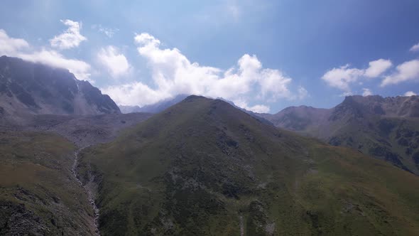 Clouds Flow Around the Tops of High Mountains