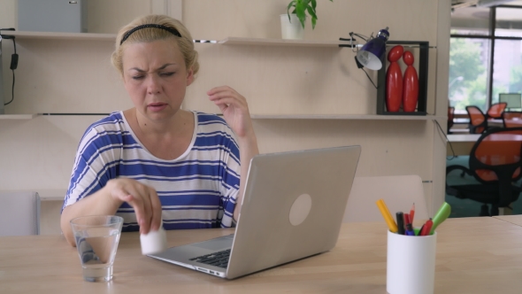 Ill Girl At The Working Space Wearing In Casual Top.