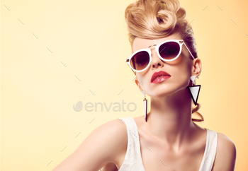 style. Fashion Makeup. Blond sexy Model, Trendy Glamour sunglasses. Playful girl cheeky emotion. Unusual Creative.Party disco mohawk hairstyle