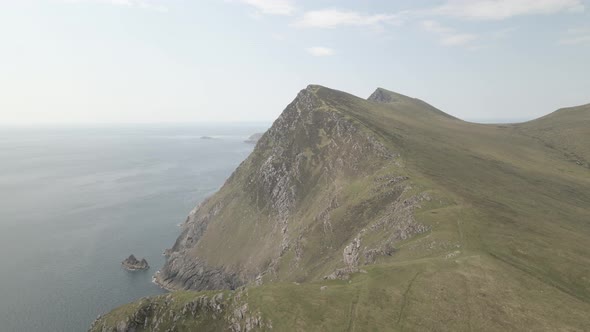 Stunning View Of Croaghaun Cliff In Fog On Achill Island In County Mayo, Ireland. aerial