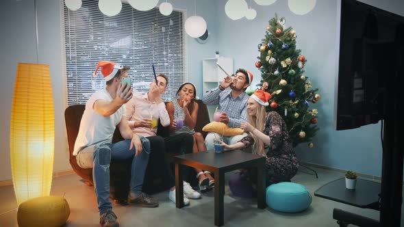 Young Mixed Race People in Santa Hats Making Video Call By Smartphone on Christmas Party