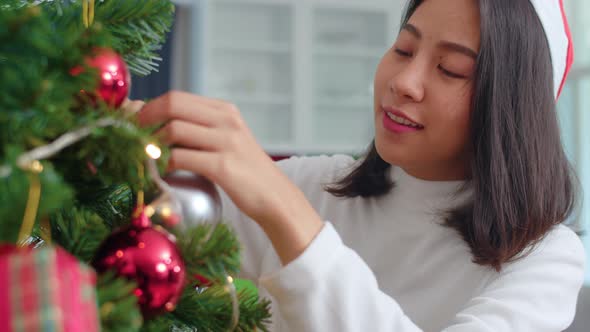 Female teen happy smiling celebrate xmas winter holidays in living room.