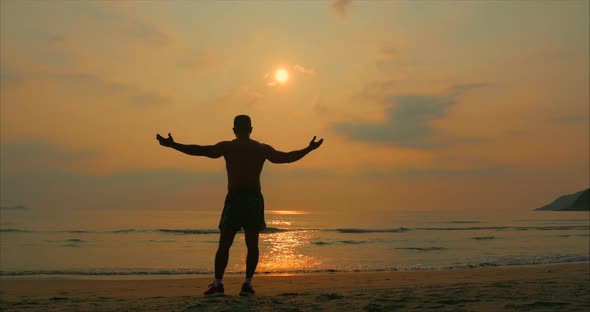 Young Man Athlete Looking Towards the Sun, Against the Sunset