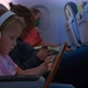 Children with Gadgets and Sleeping Mother in the Plane - VideoHive Item for Sale