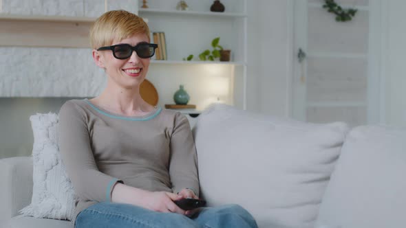 Young Attractive Woman Wearing 3d Glasses Holding Remote Control Watching Funny Television Show