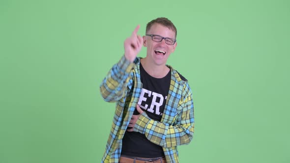 Portrait of Happy Nerd Man Laughing and Pointing at Camera