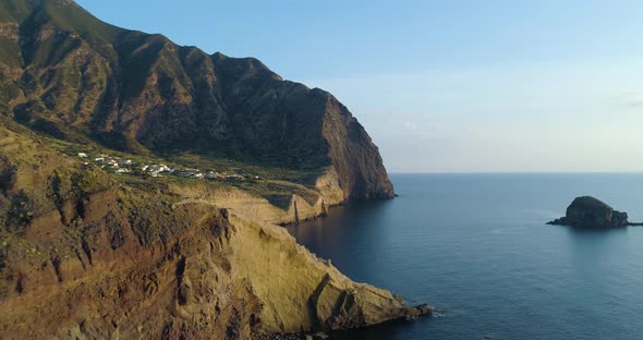 Aerial View of Salina Coast Deep Cliff Little Village in a Summer Sunset