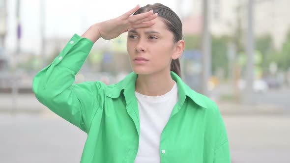 Hispanic Woman Looking Around for Opportunity Outdoor