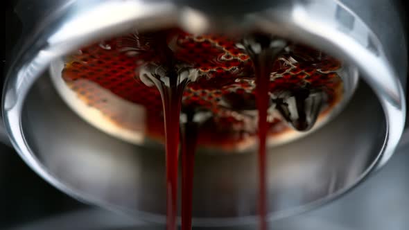 Super Slow Motion Macro Shot of Dripping Fresh Espresso Coffee From Lever Machine at 1000 Fps