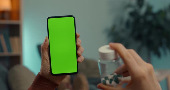 Man Using Green Screen Mobile for Video Call with Doctor