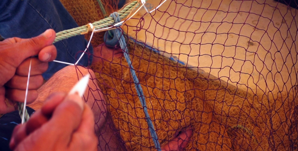 Fisherman Repairs Fishnets 2