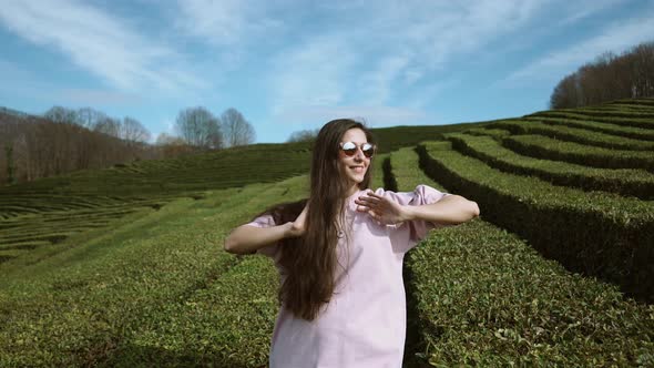 Alone Freedom Loving Girl Is Enjoying Fresh Air Over Tea Garden in Spring Day