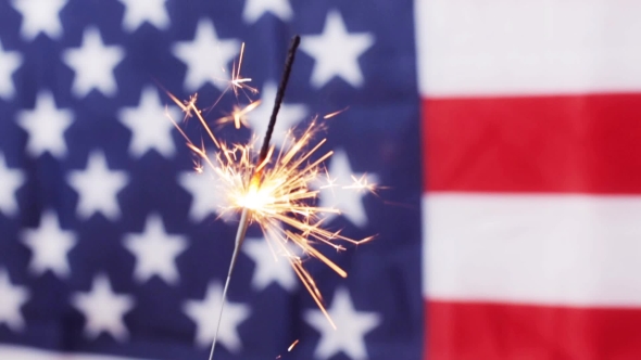  Of Sparkler Burning Over American Flag