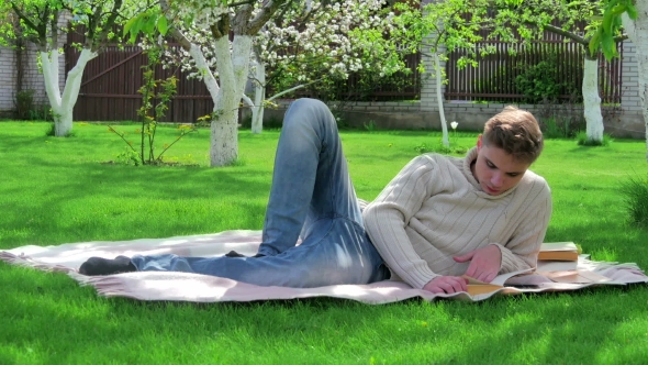 Young Handsome Guy Resting In The Yard