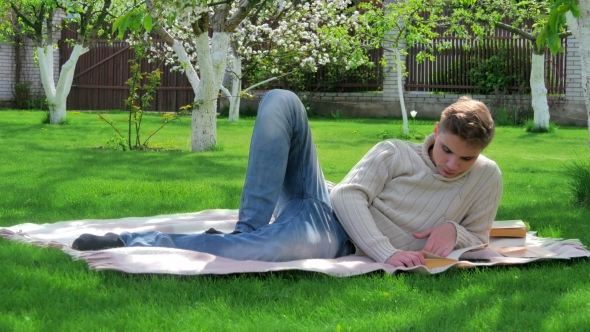 Young Handsome Guy Resting In The Yard