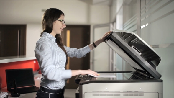 The Young Girl Printing In The Office