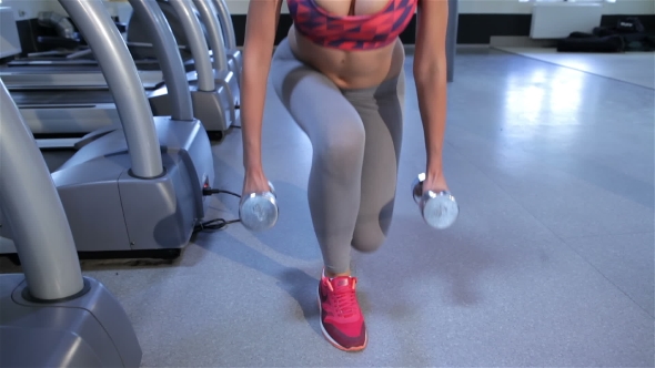 Woman Trains Gluteal Muscles At The Fitness Centre