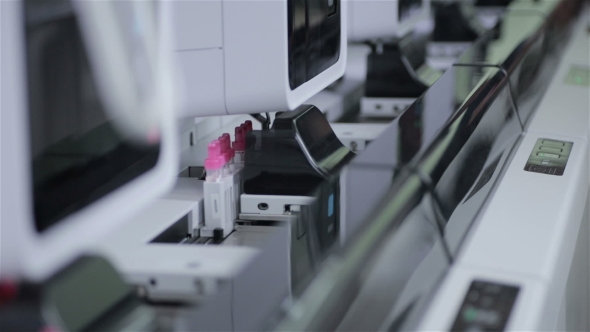 Modern Automatic Medical Hematology Analyzer. Test Tubes On Robotic Conveyor.