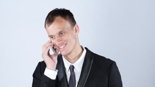 Smiling Handsome Man Talking on Phone