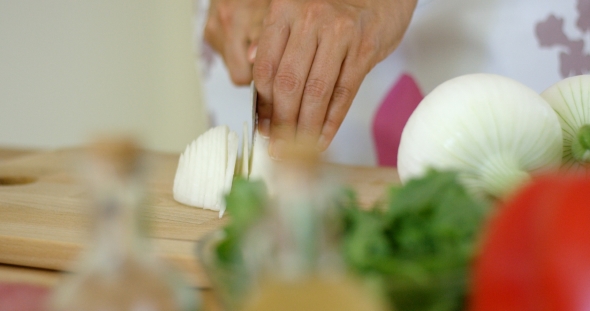  On Hands Cutting Fresh Onion