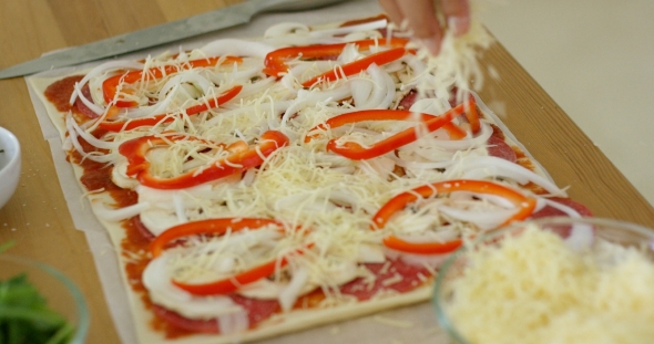 Woman Make a Tasty Traditional Homemade Pizza