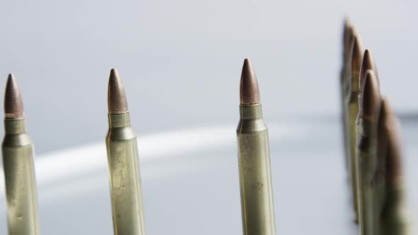 Cinematic rotating shot of bullets on a metallic surface - BULLETS 062