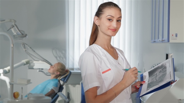 Female Dentist Poses At The Dental Clinic