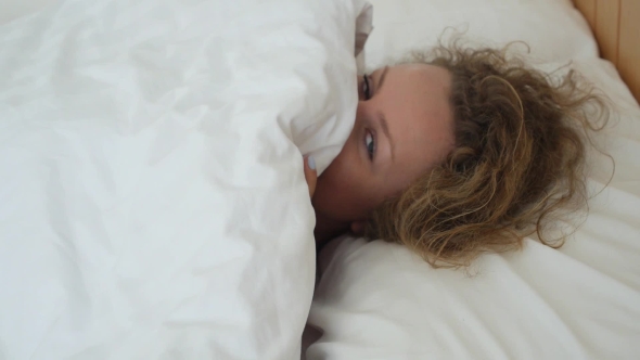 Beautiful Girl Lying In Bed Flirting And Seducing