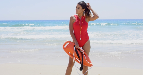 Side View On Woman In Red With Buoy