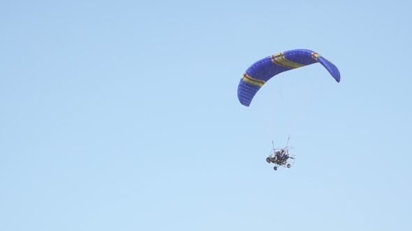 Parachute With Motor Flying In The Air