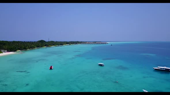 Aerial drone view seascape of tranquil coastline beach holiday by blue water and white sandy backgro