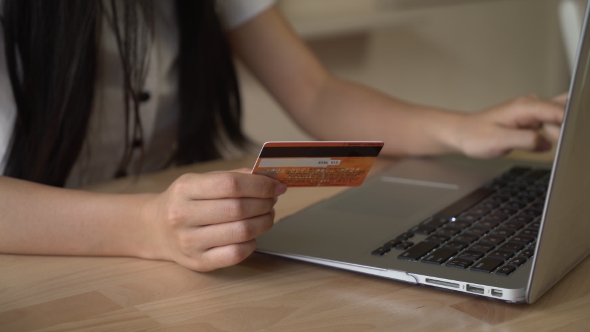 Unrecognizable Female Buying Via Internet.