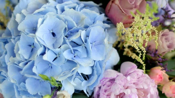 Arrangement Of Different Flowers Of Different Colors, Standing On Tables For a Holiday Decoration