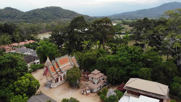 Classic Buddhist Temple Between Forest. From Above Drone View Classic Buddhist Monastery Between