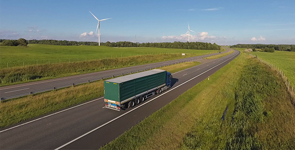 Fast Cargo Truck Driving On Highway