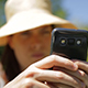 Young Woman Using Phone in Nature - VideoHive Item for Sale