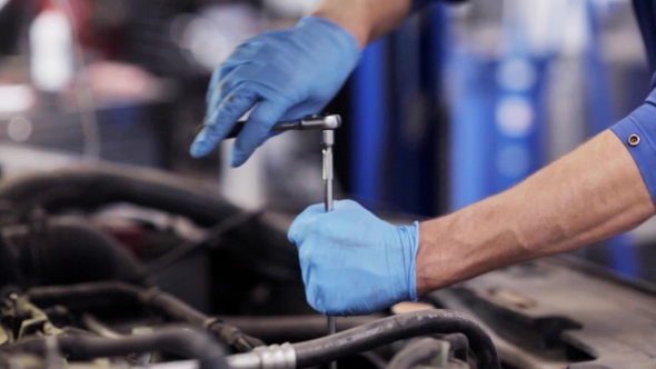 Mechanic Man With Wrench Repairing Car At Workshop 33