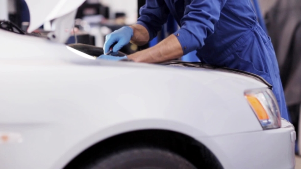 Mechanic Man With Wrench Repairing Car At Workshop 31