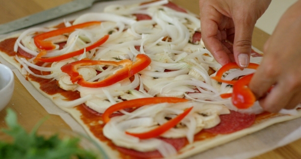 Woman Make a Tasty Traditional Homemade Pizza