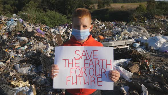 Portrait of Small Boy Holding in Hands Poster of Environmental Movement for Saving Planet