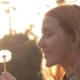 Side View Of Blonde Girl Blowing On Dandelion - VideoHive Item for Sale
