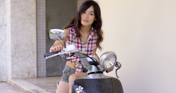Attractive Young Woman On a Motorcycle